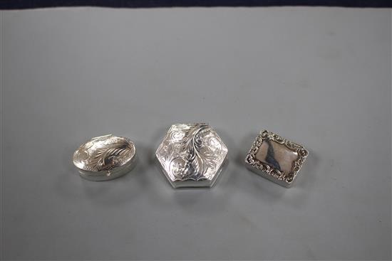 Three assorted modern silver pill boxes, including engraved hexagonal and rectangular with scroll border, largest 31mm.